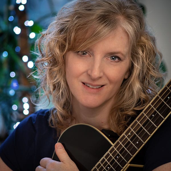 Ally and guitar showing round Bokeh at f4