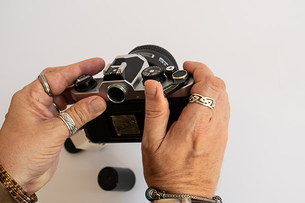 How to load film into a camera - use the shutter and film advance lever on