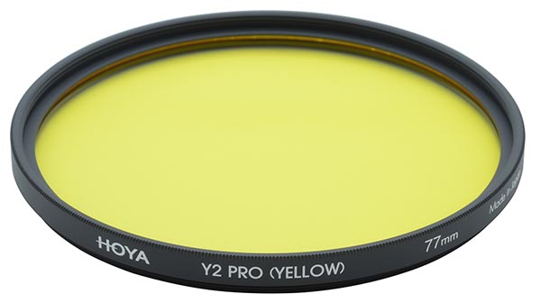 To make the sky dark in a black and white film image use a yellow filter