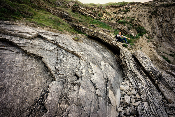 Jethro photographing at Lulworth Cove in the Jurassic rocks.