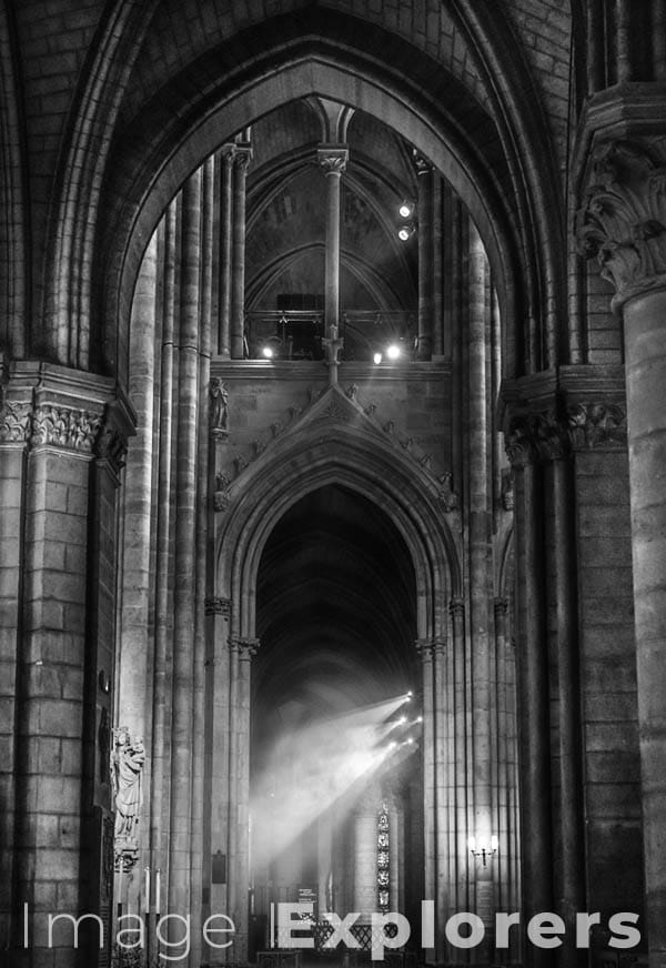 Notre Dame arches and incense smoke